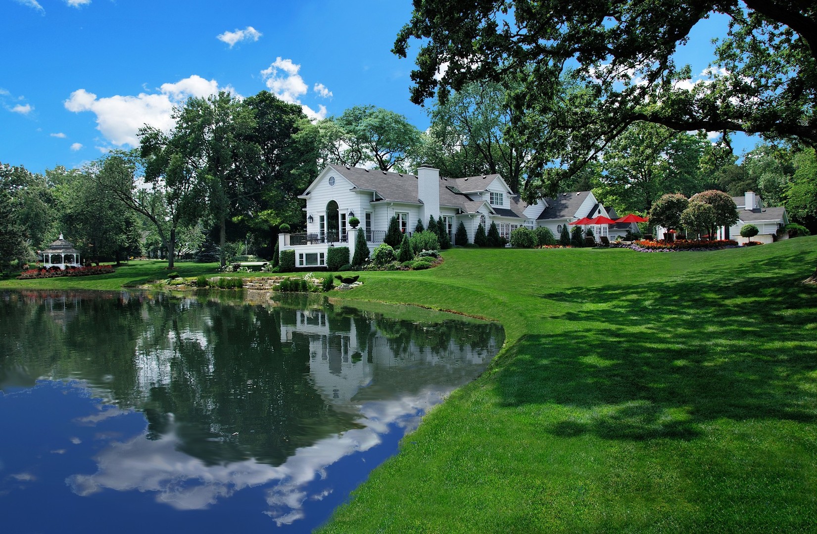 a view of a lake with a house in the background