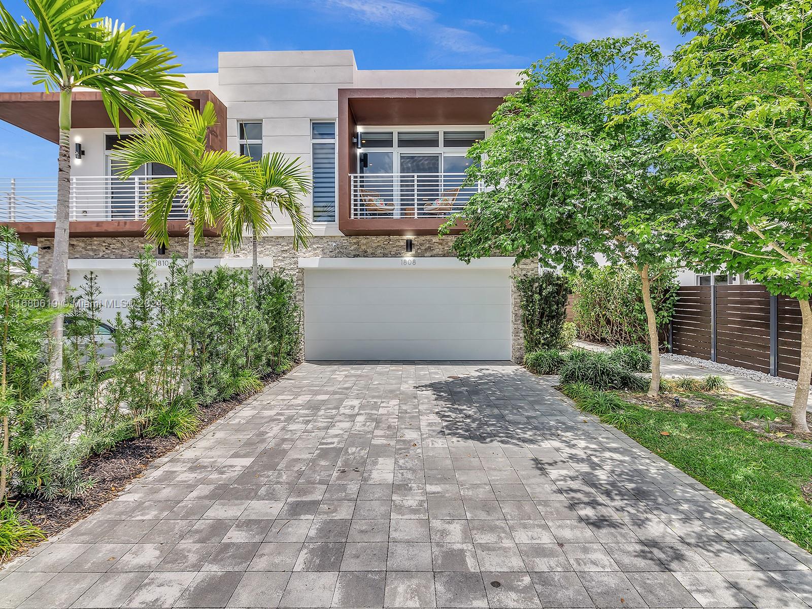 a house with a yard and a large tree