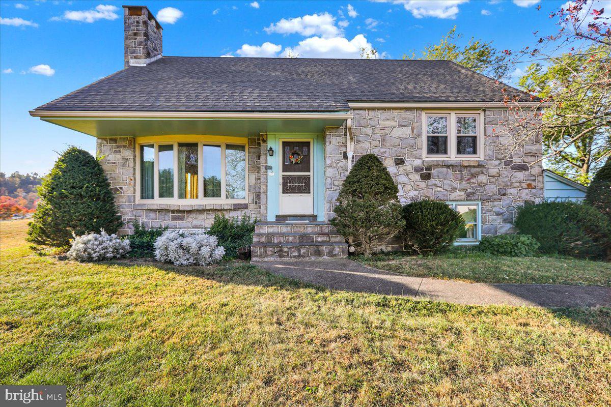 front view of a house with a yard