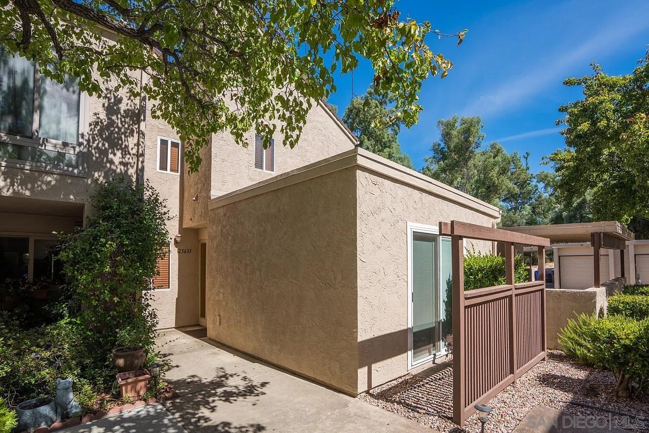 a view of a house with a tree