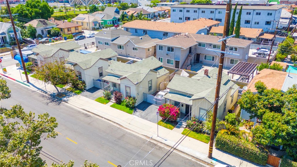 an aerial view of a houses with yard