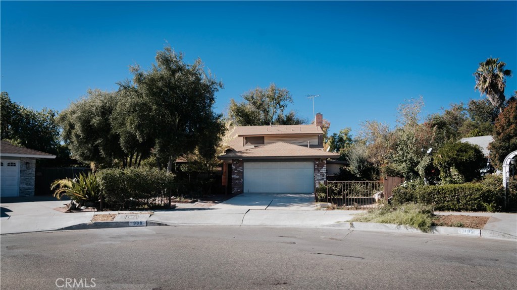 a view of a house with a yard and tree s