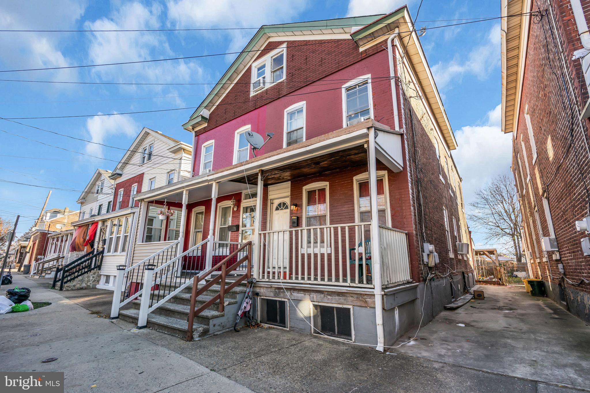 a view of a house with a yard and deck