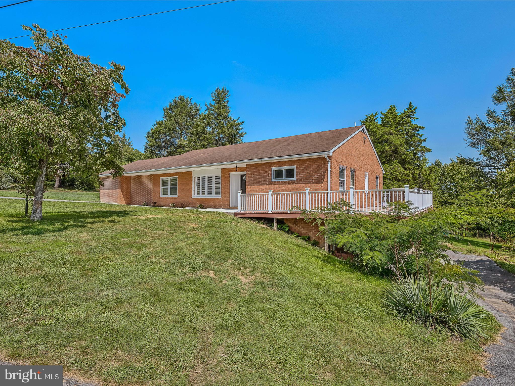 a view of a house with a backyard