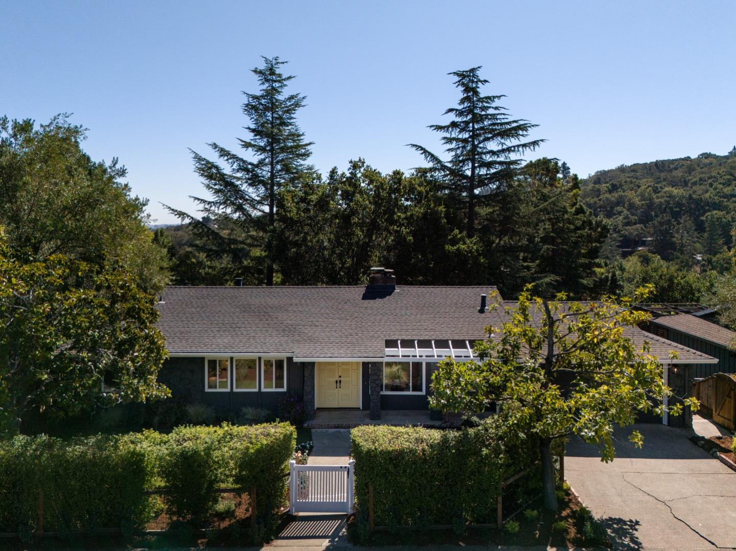 aerial view of a house with a yard