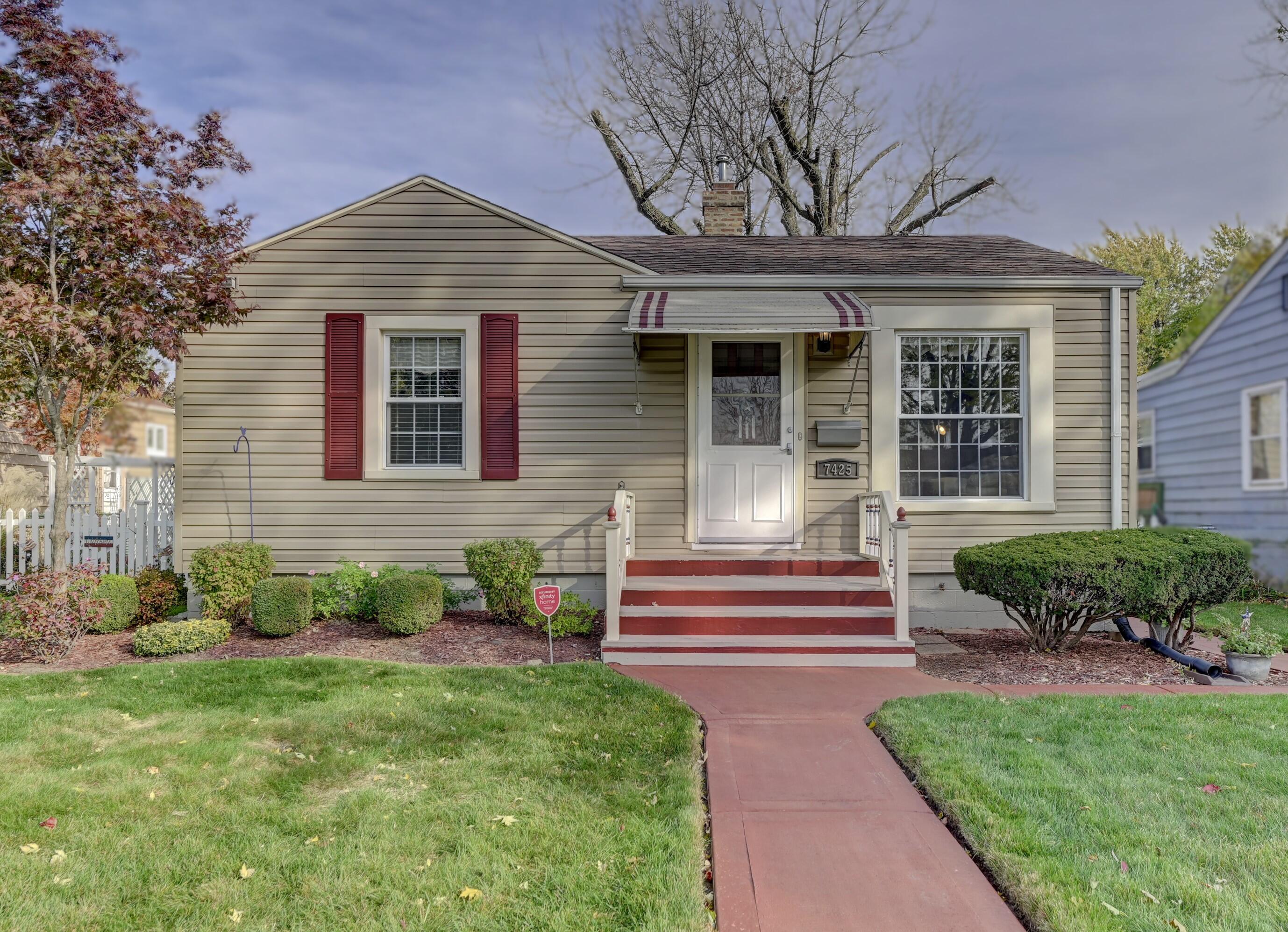 front view of a house with a yard