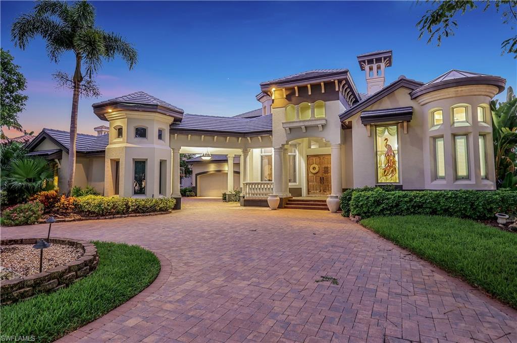 a front view of a house with a garden and patio