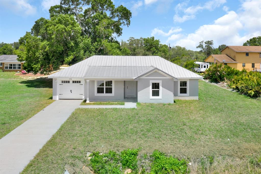 front view of a house with a yard