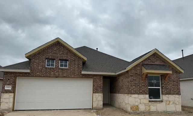 a front view of a house with a garage