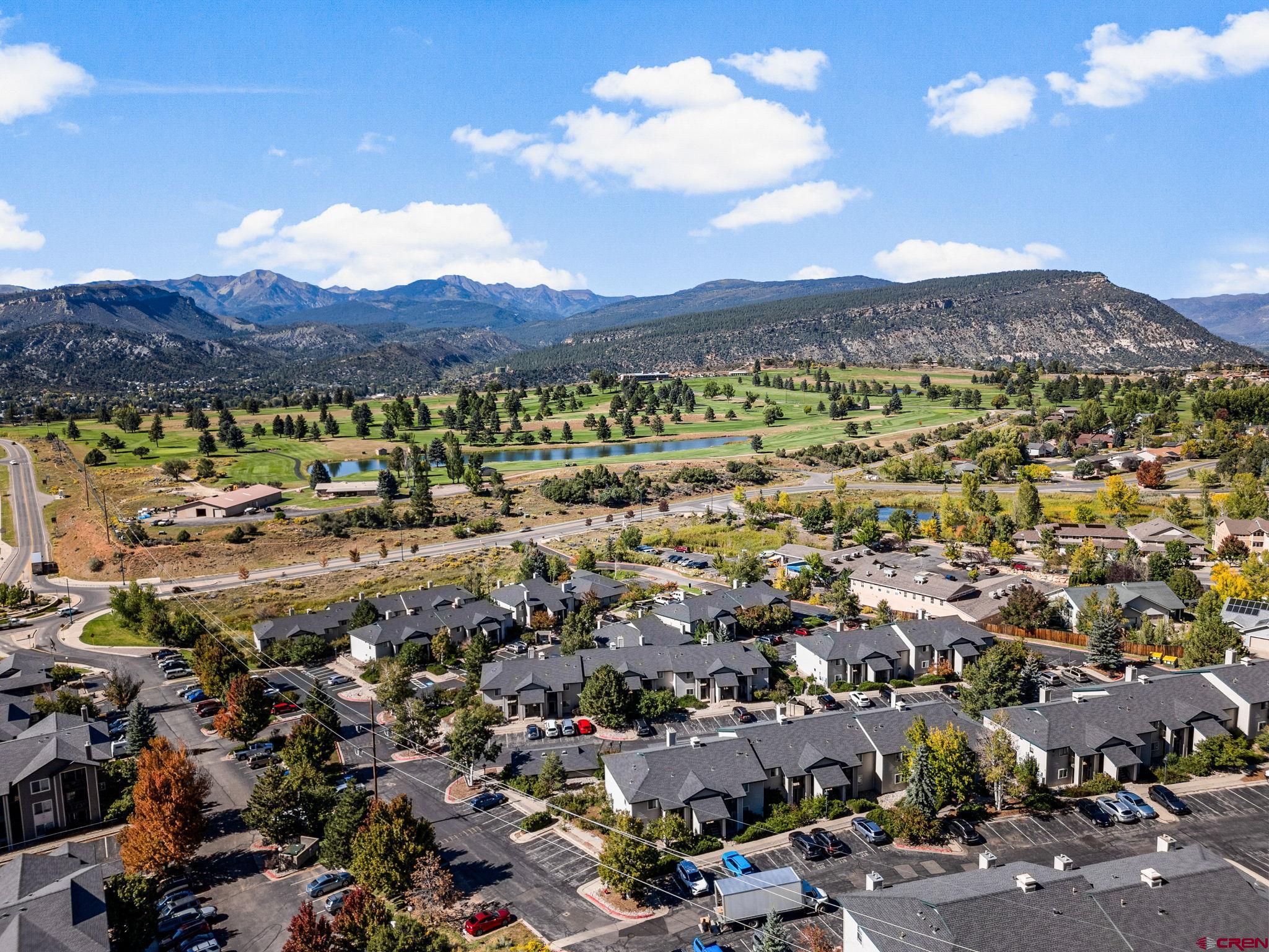 an aerial view of residential houses and outdoor space