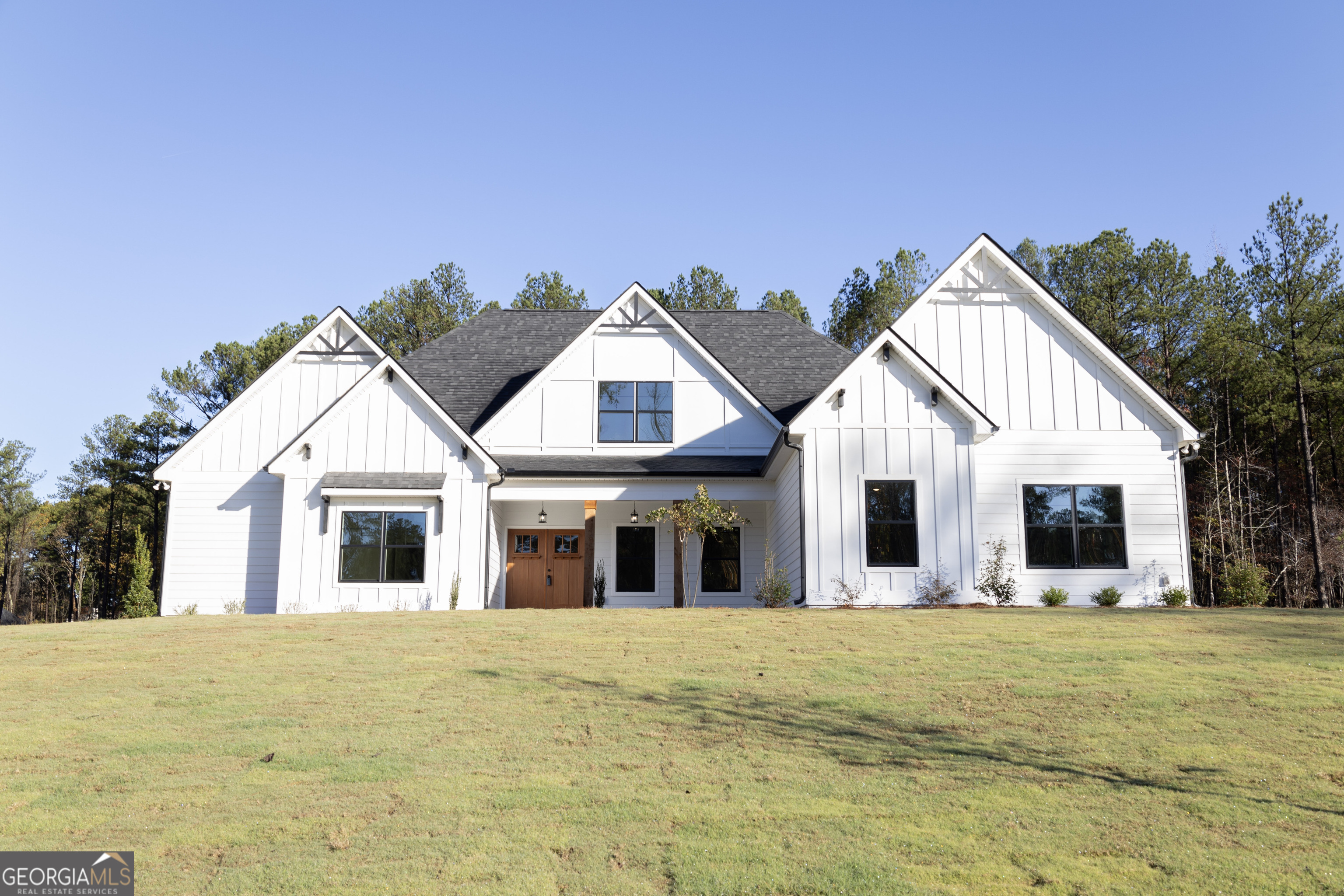 a view of a white house with a outdoor space