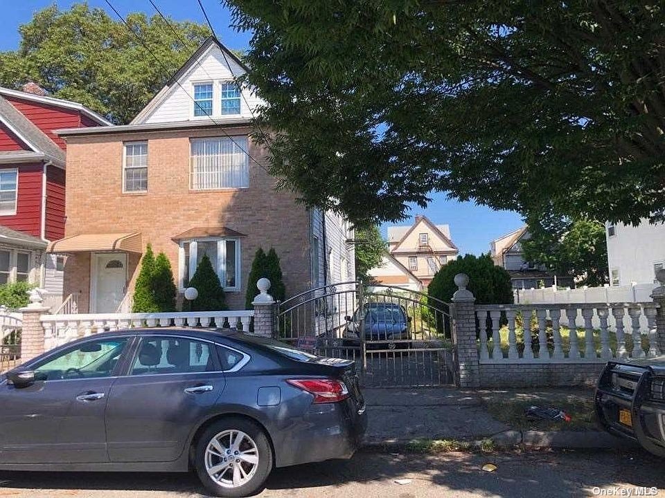 a front view of a house with parking