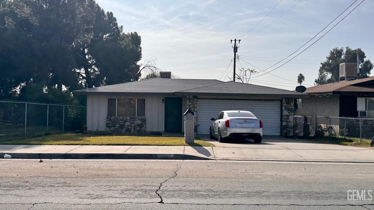 a view of a house with swimming pool and a yard