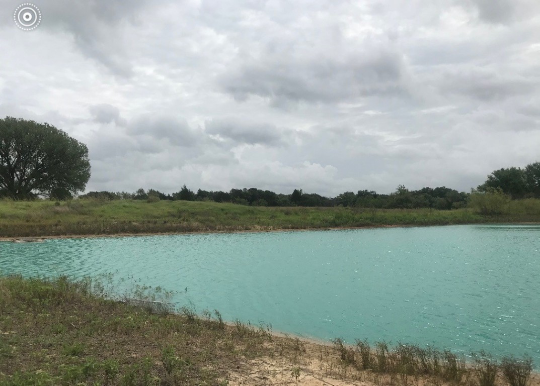 a view of a lake from a yard