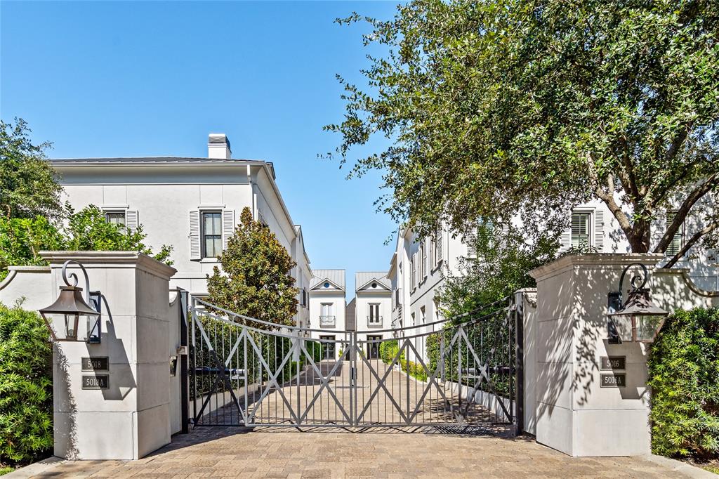 Welcome to this luxurious gated estate in Tanglewood. The gated entrance provides privacy and security while lantern lamps flank the pillars adding timeless curb appeal.