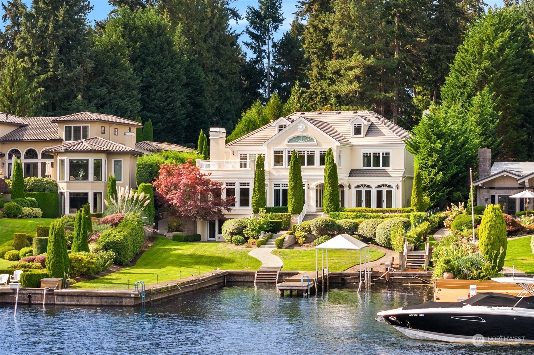 a swimming pool with outdoor seating and yard