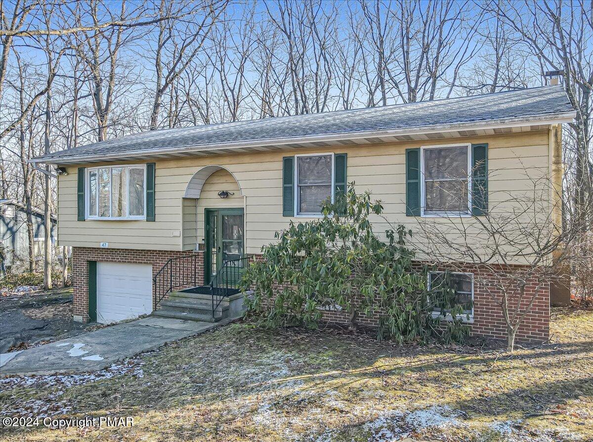 front view of a house with a dry yard