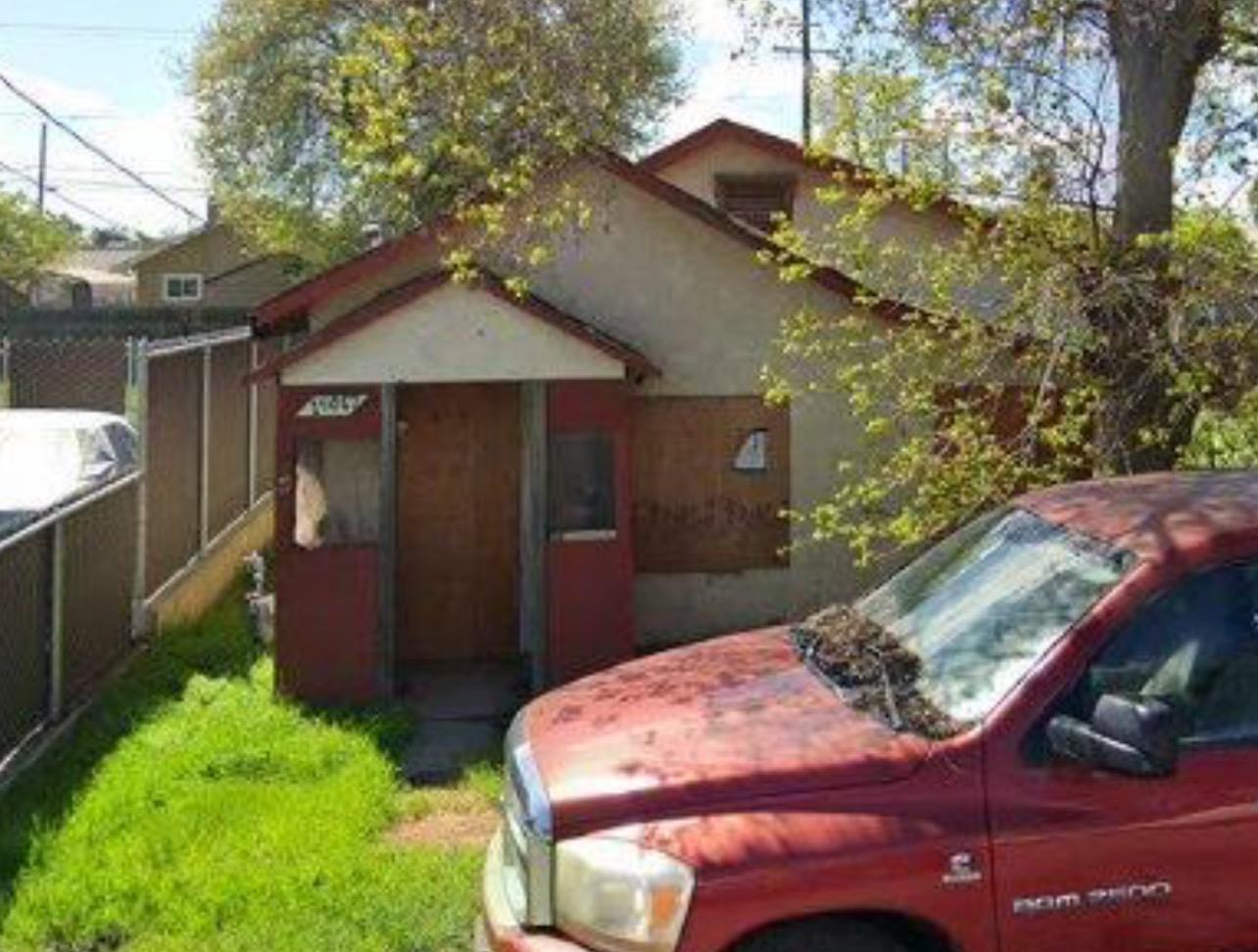 a backyard of a house with yard and garage