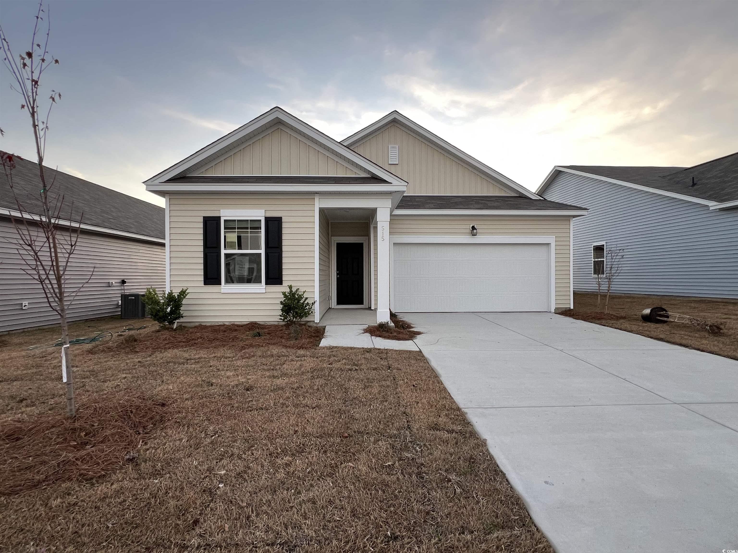 View of front of house with central AC unit and a