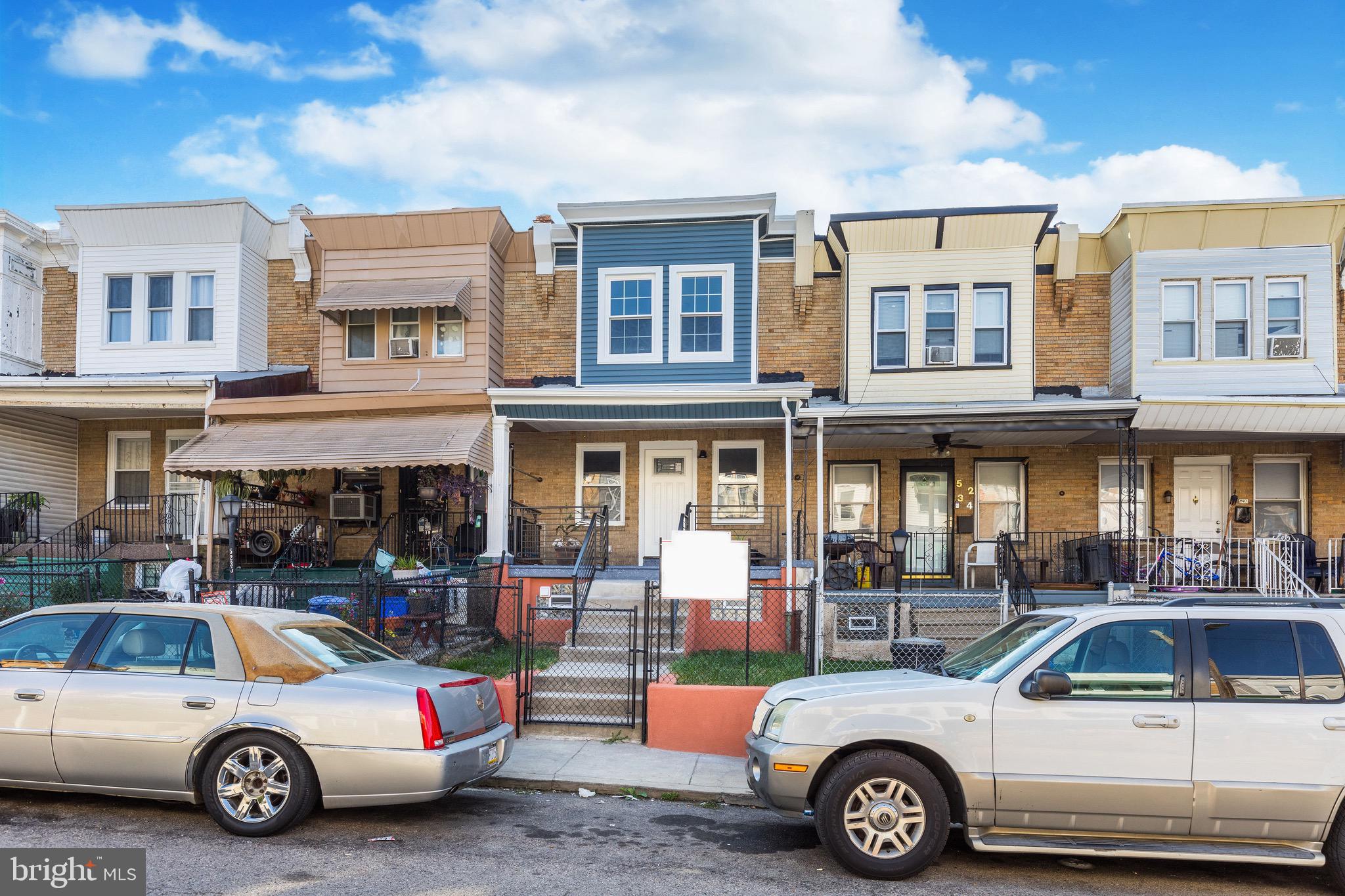 a view of a cars park in front of a building