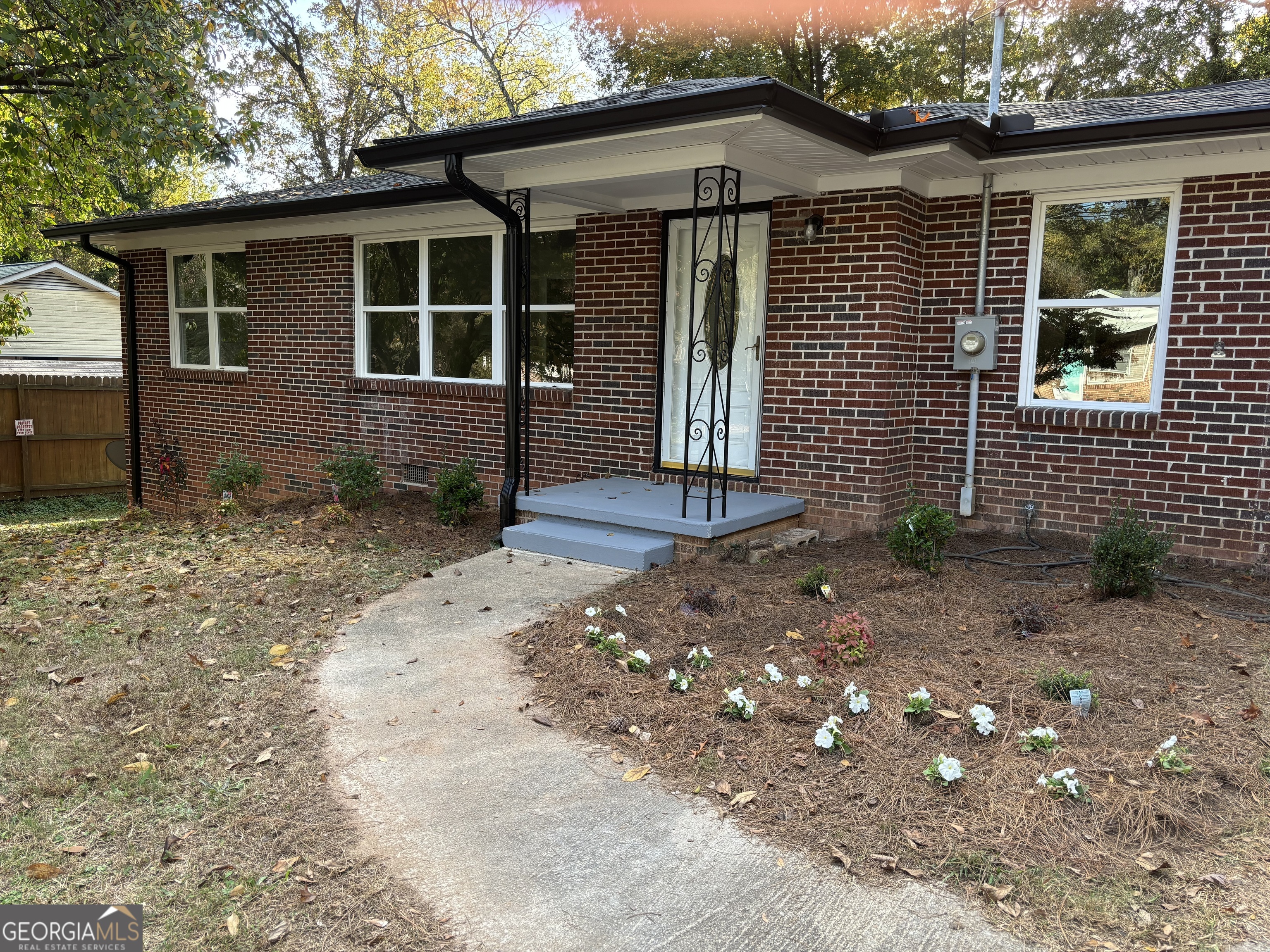 a front view of a house with garden