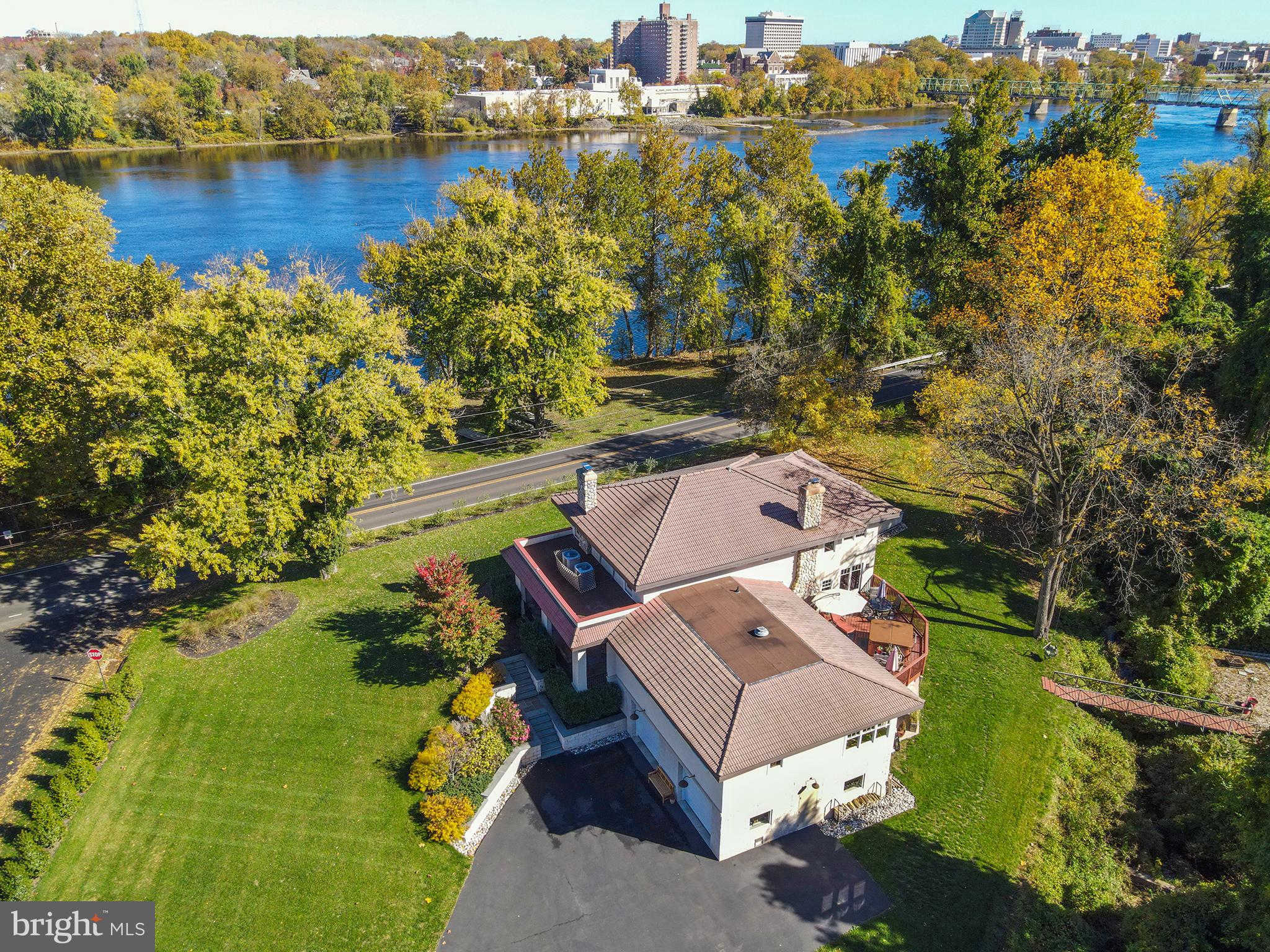 an aerial view of a house with a lake view