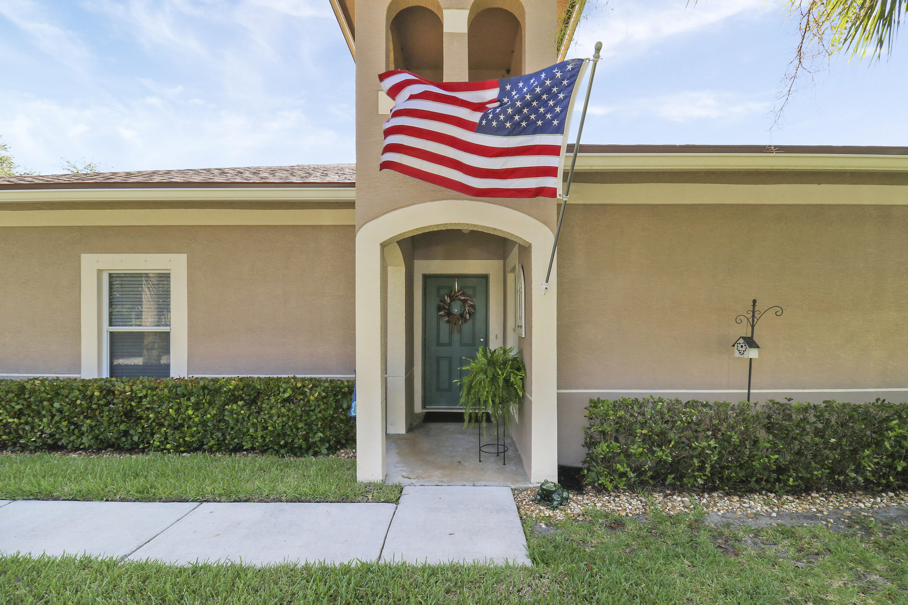 a view of front door and small yard