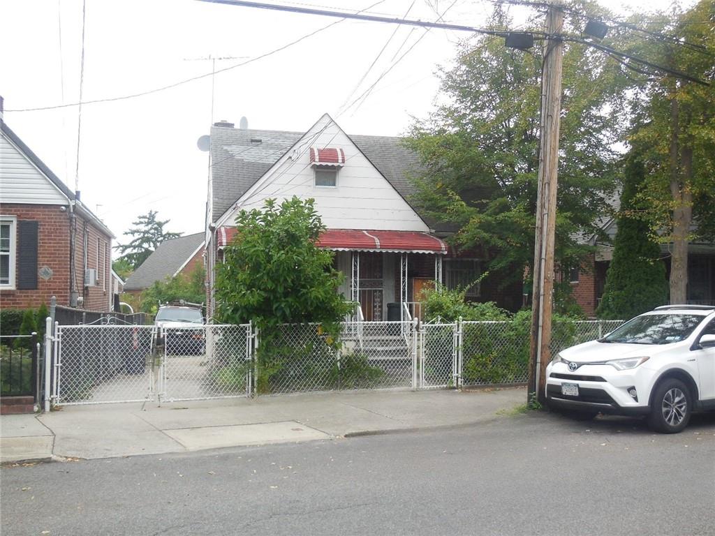 a view of a car parked in front of house