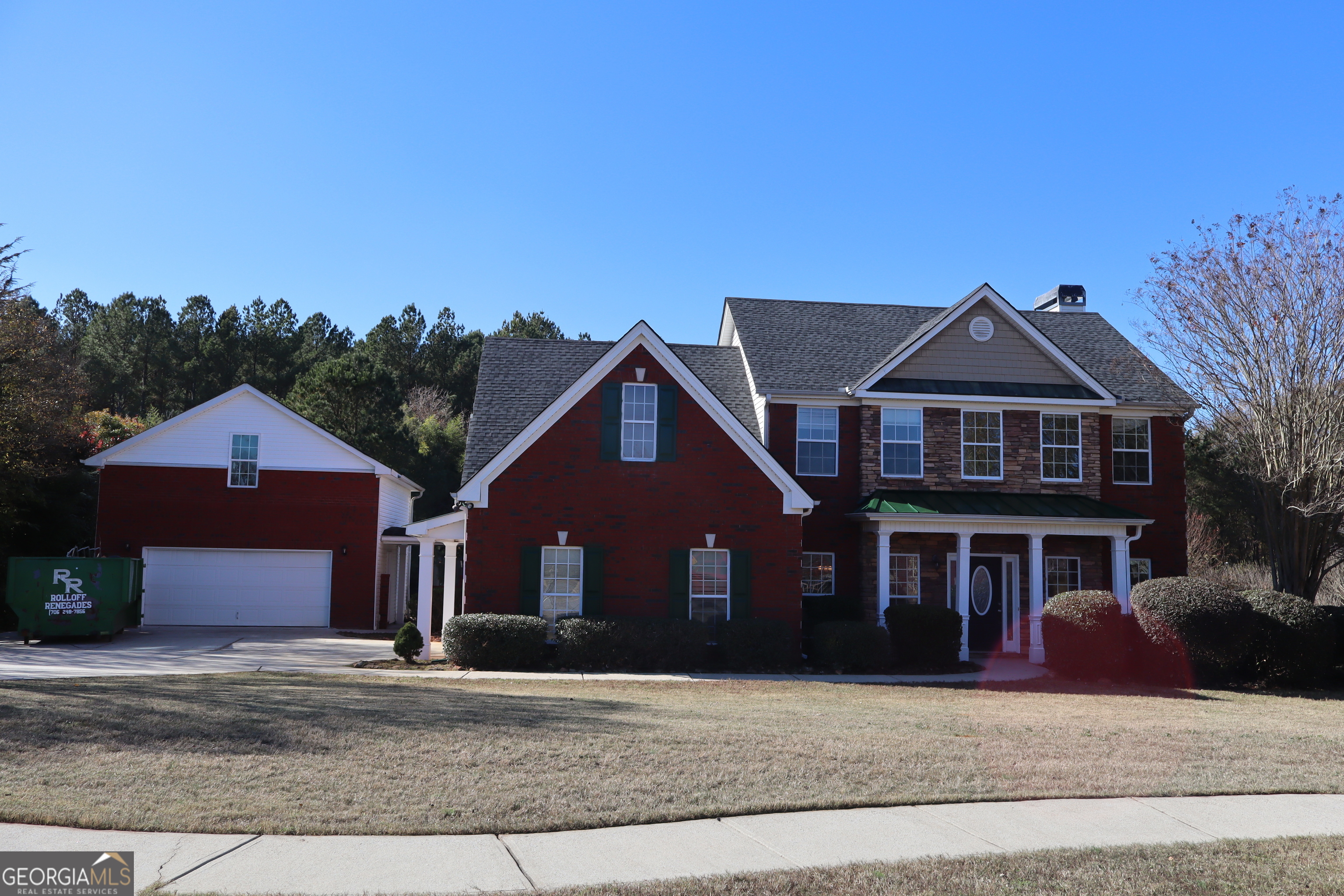 a front view of a house with yard