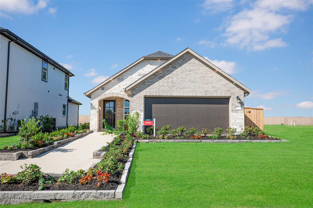 a front view of house with garden