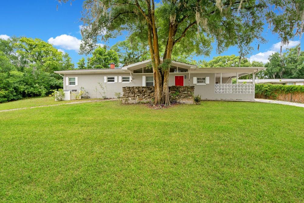 front view of a house with a big yard