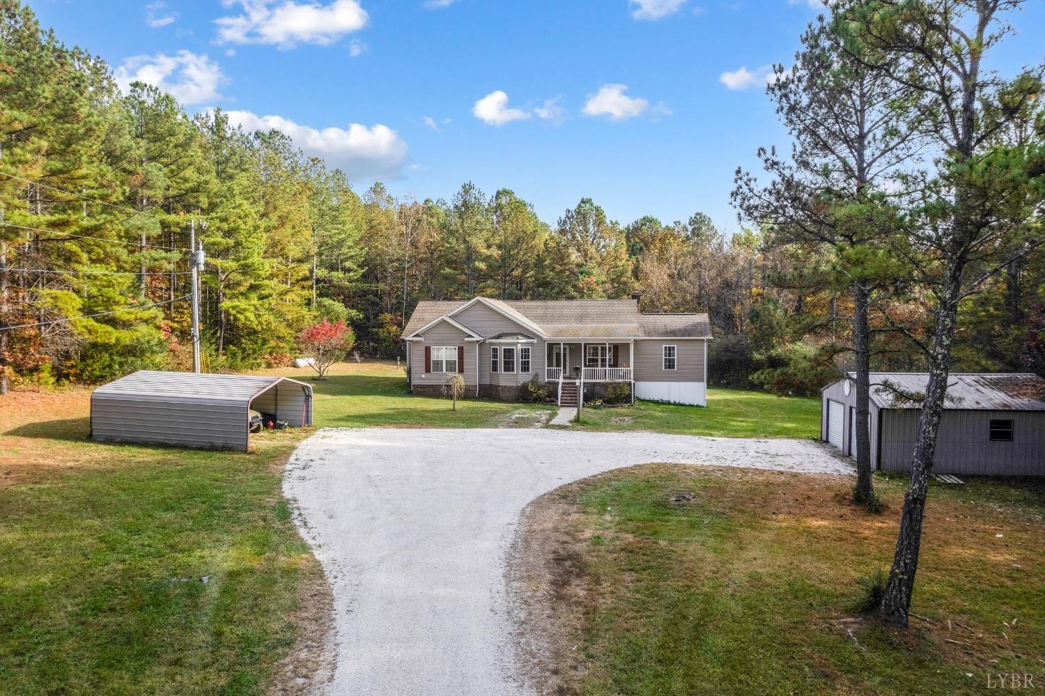 a view of a house with a yard porch and sitting area