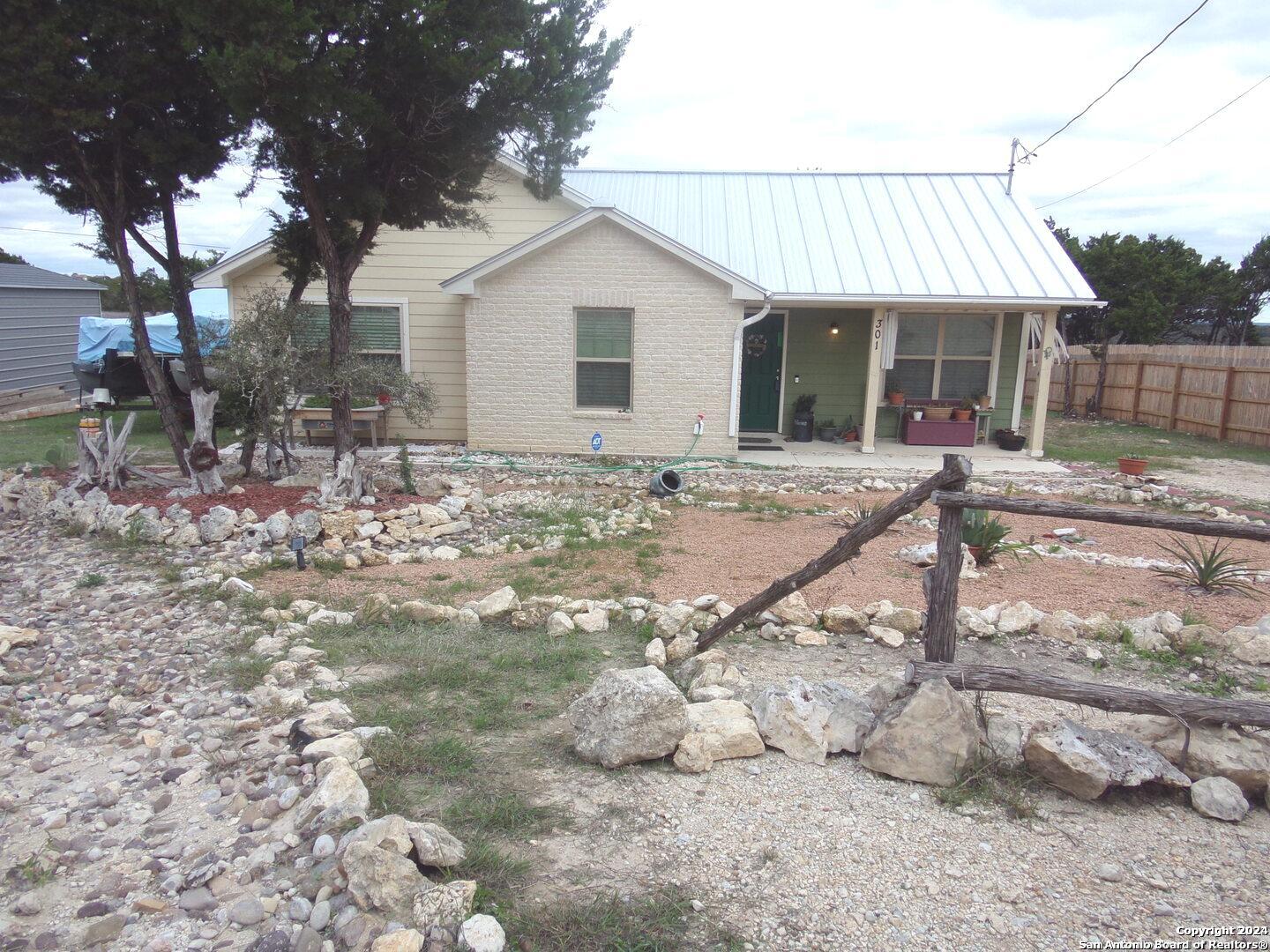 a view of a house with backyard of the house