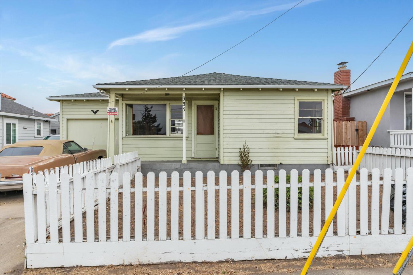 a view of a house with wooden deck