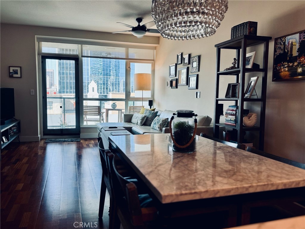 a dining room with furniture and wooden floor