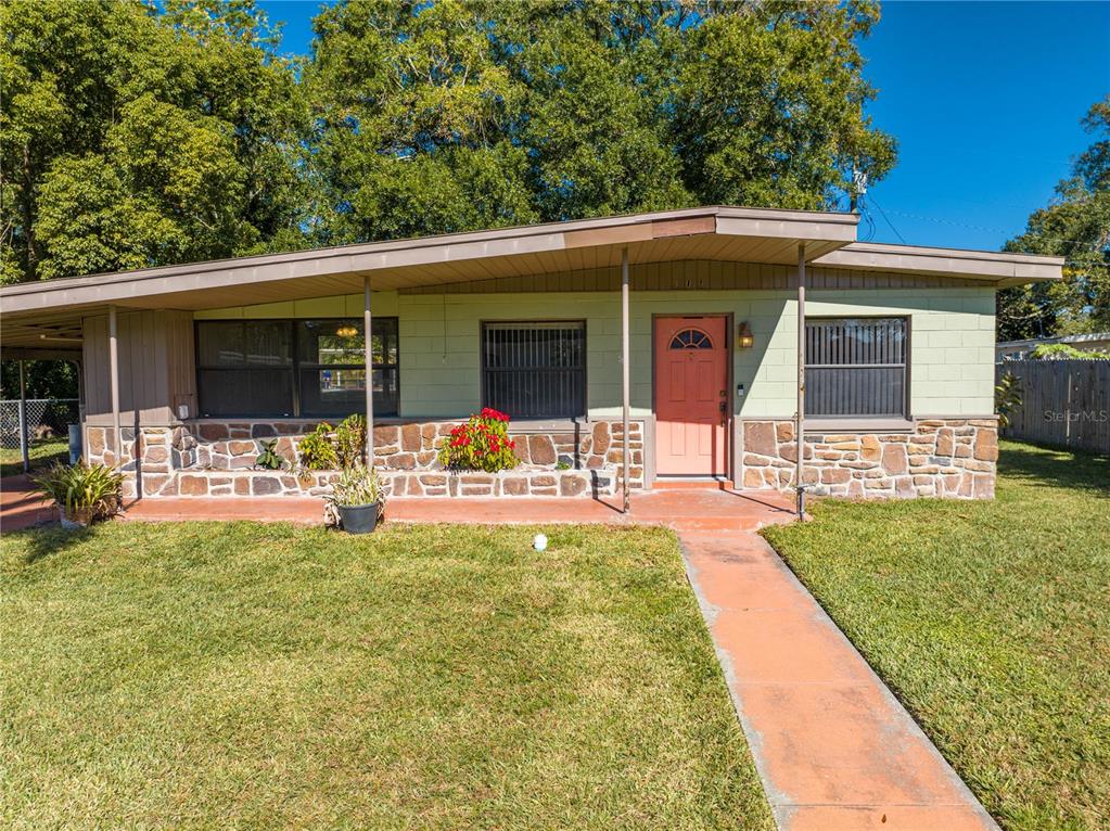 a front view of house with yard patio and green space