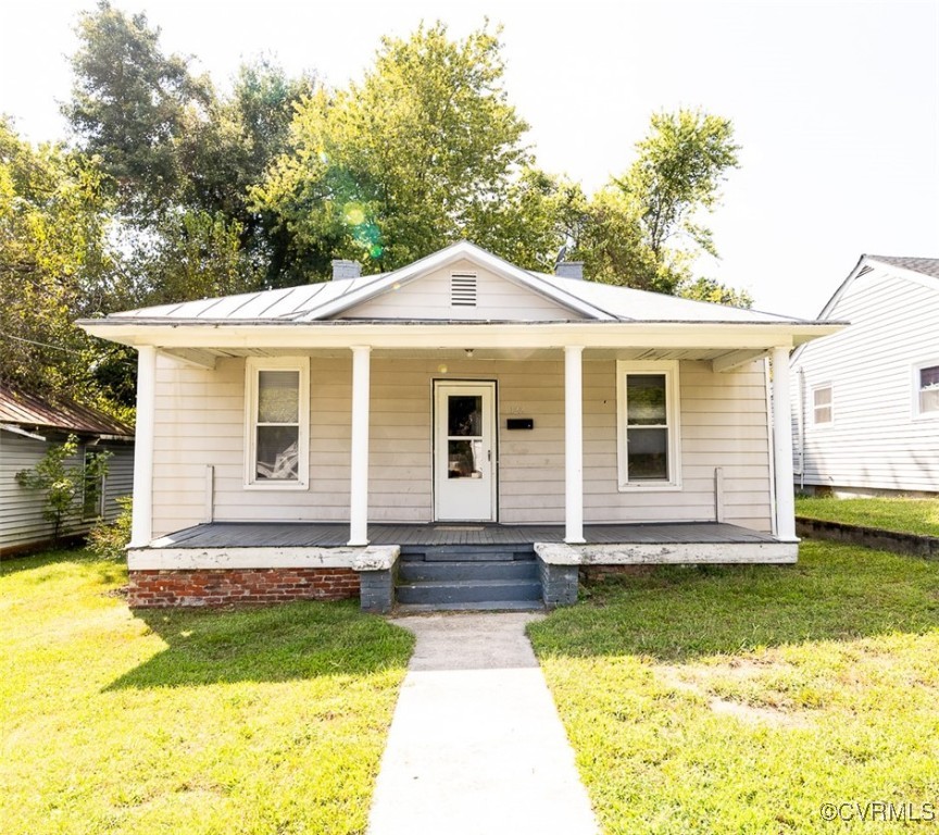 a front view of a house with yard