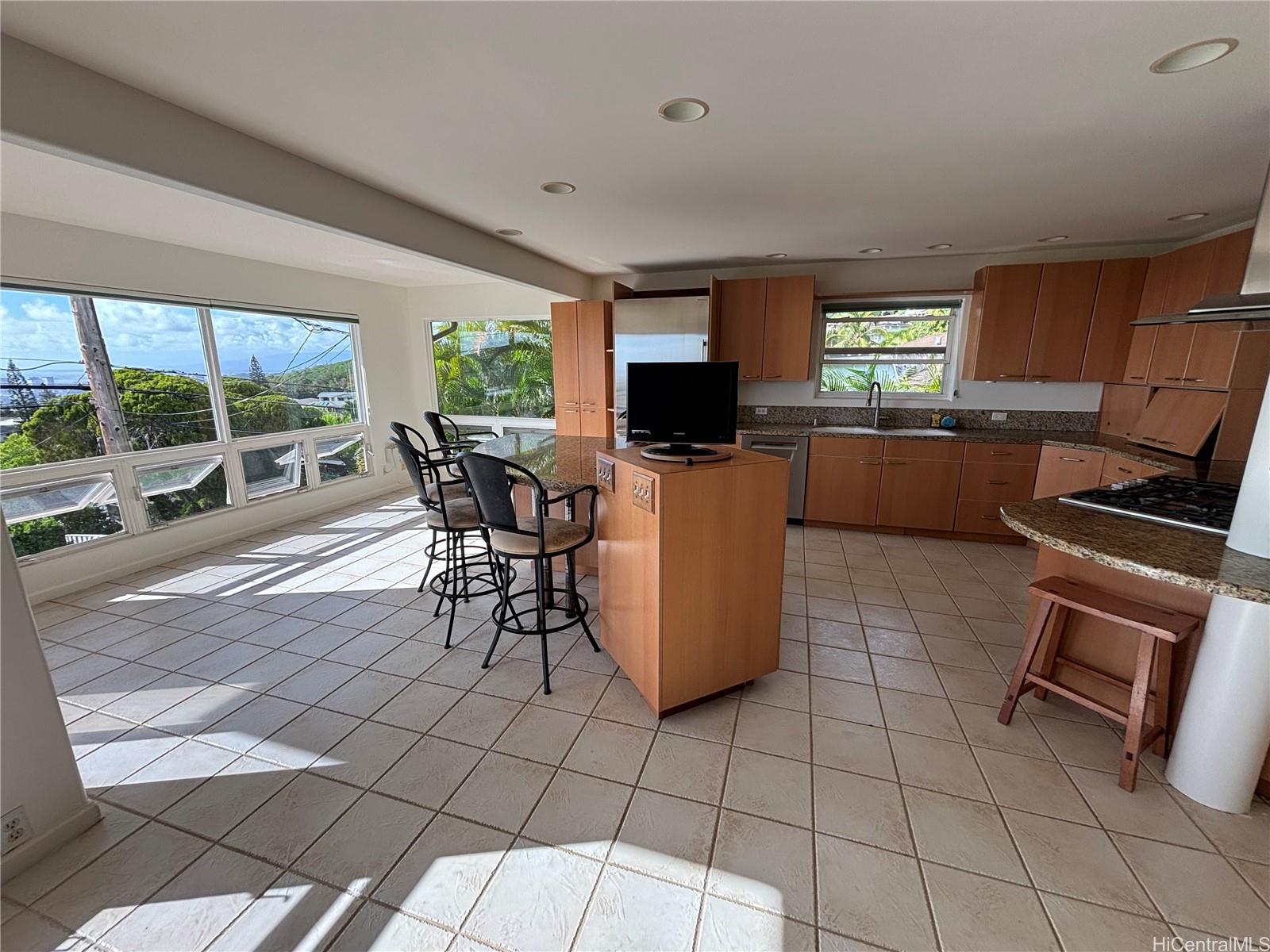 a view of a dining room with furniture window and outside view