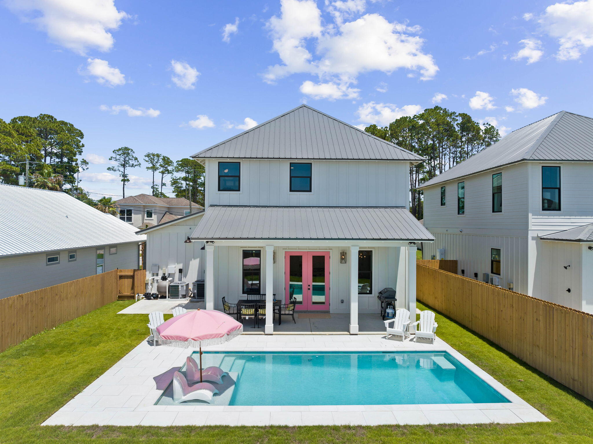 a front view of house with yard and outdoor seating