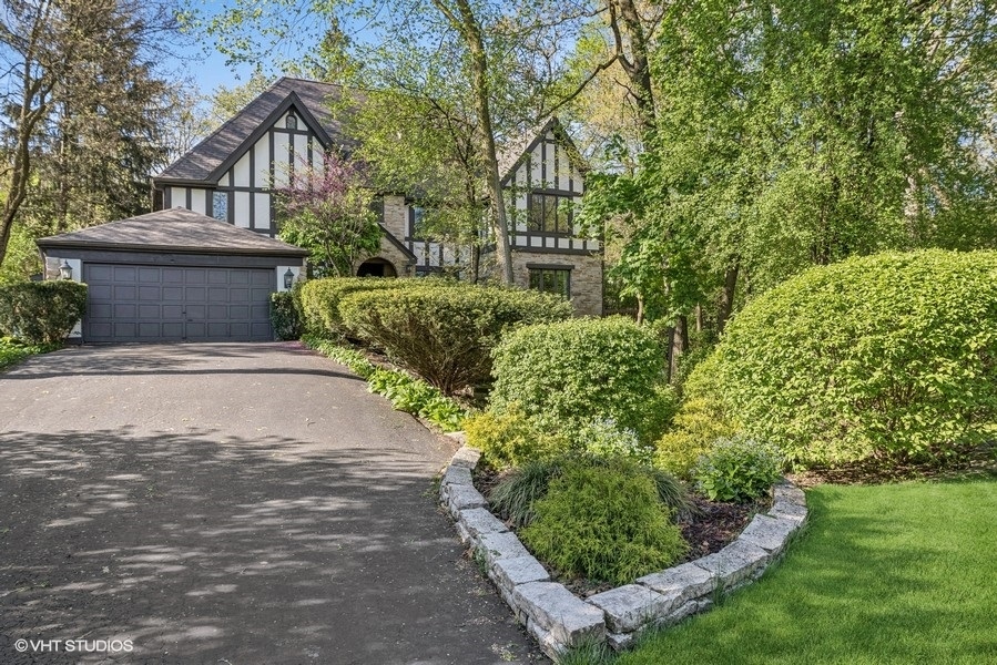 a view of a house with a yard and plants