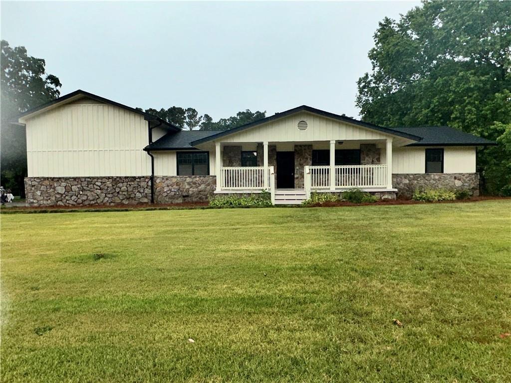 a front view of a house with garden