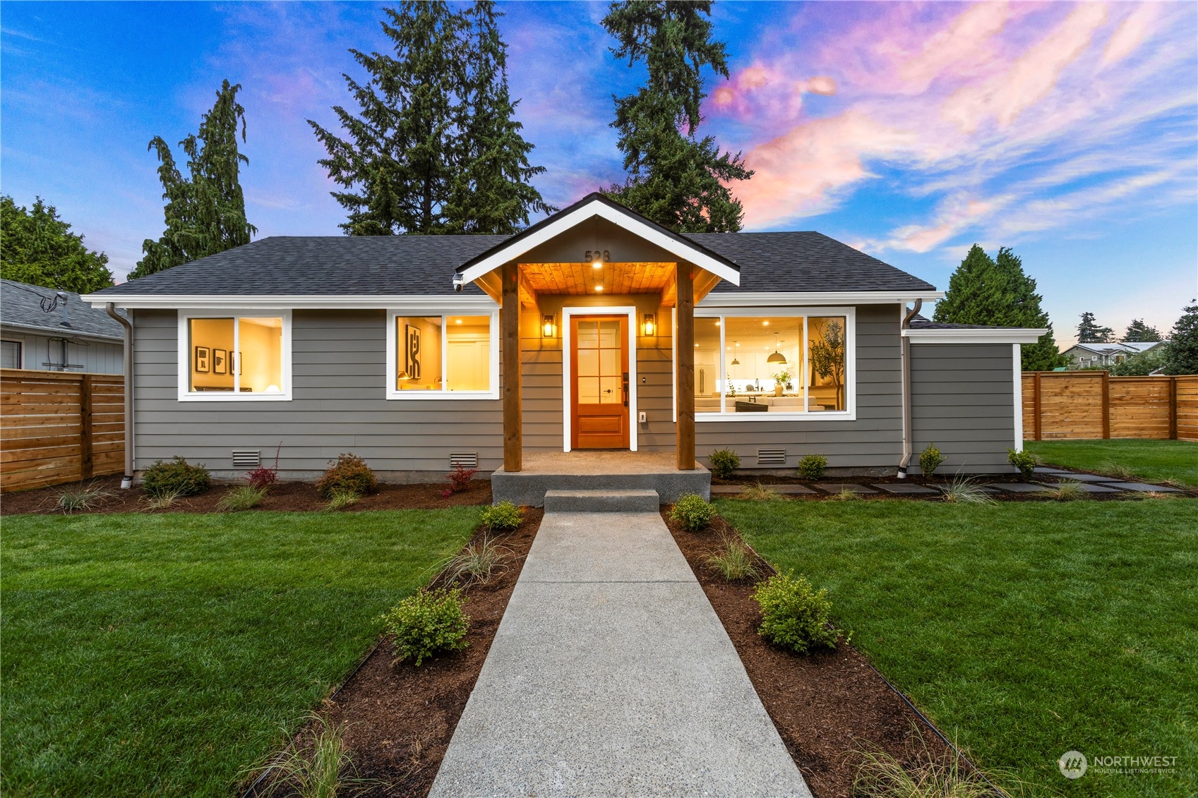 a front view of a house with yard