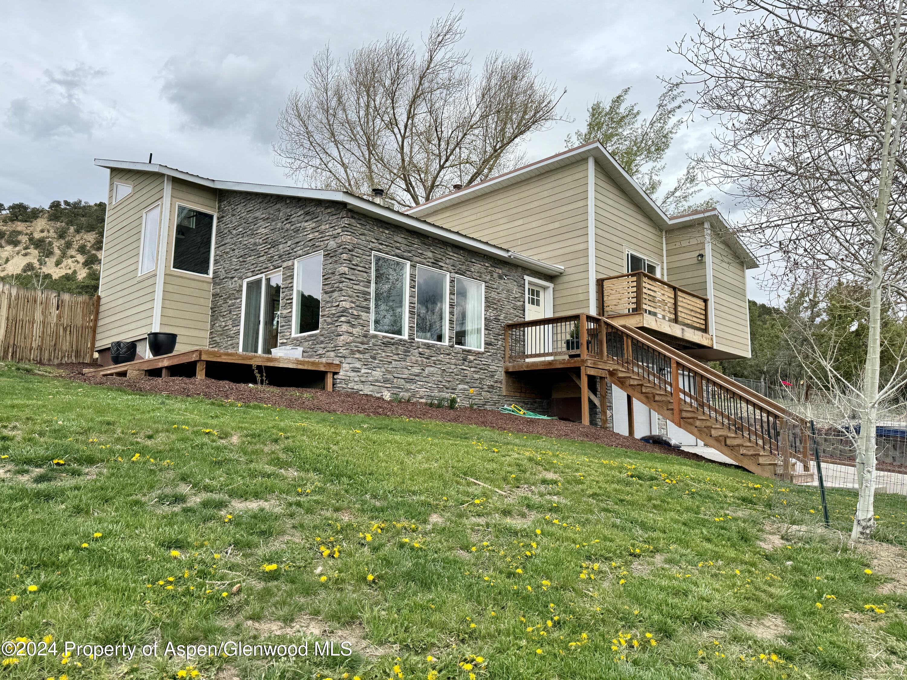 a front view of house with yard patio and green space