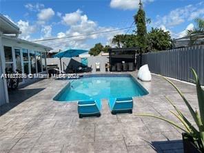 a view of a swimming pool with a patio