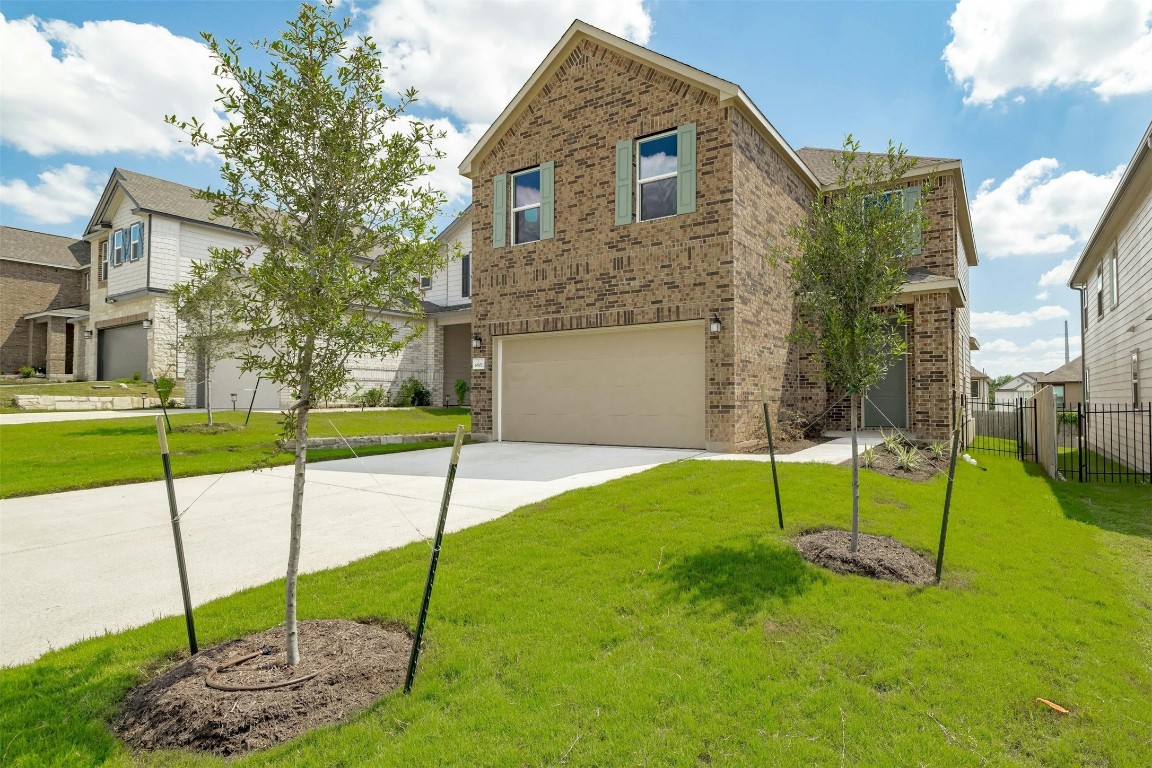 a house that has a big yard in front of it