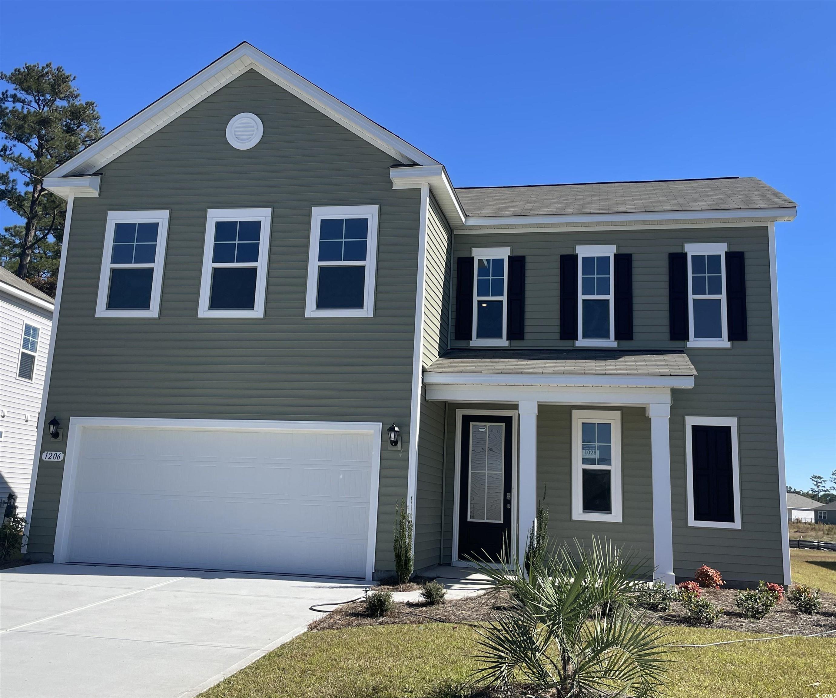 View of front of house with a garage