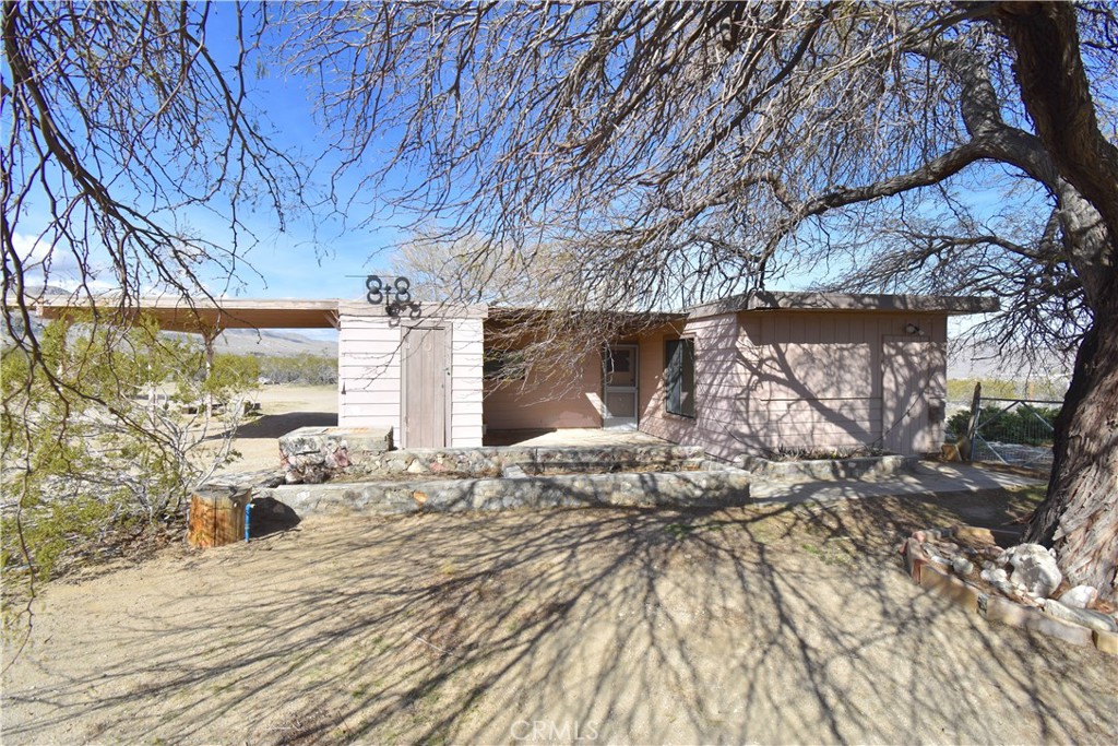 a view of a backyard of the house