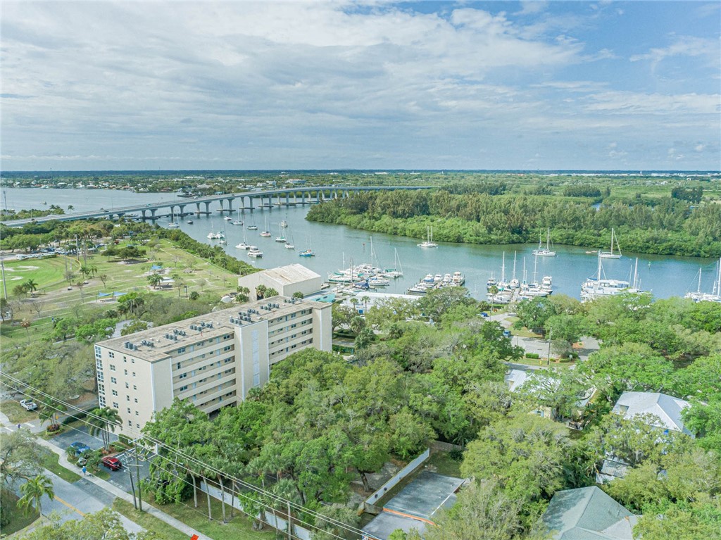 a view of a lake with houses in the back