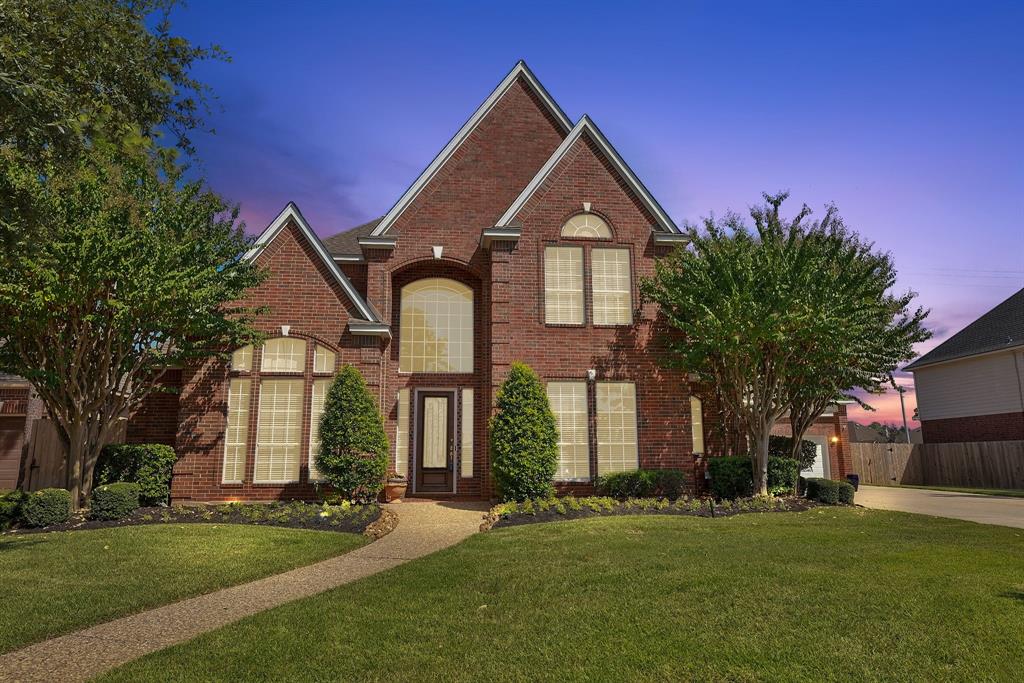 Elegant 5BR/5BA brick residence offering spacious luxury and timeless design.