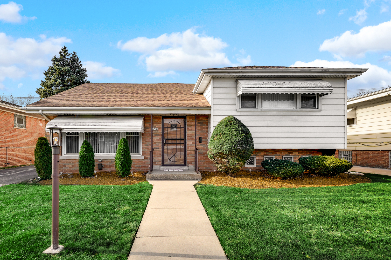 a front view of a house with a yard